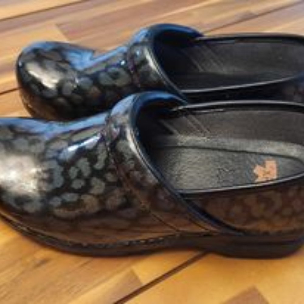 Dansko Iridescent Leopard Clogs
